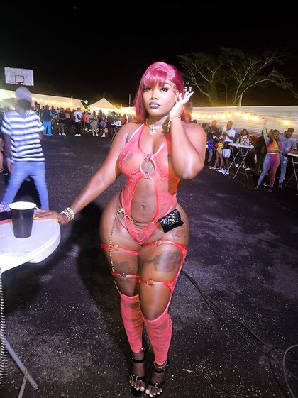 Dark skin tatted Jamaican