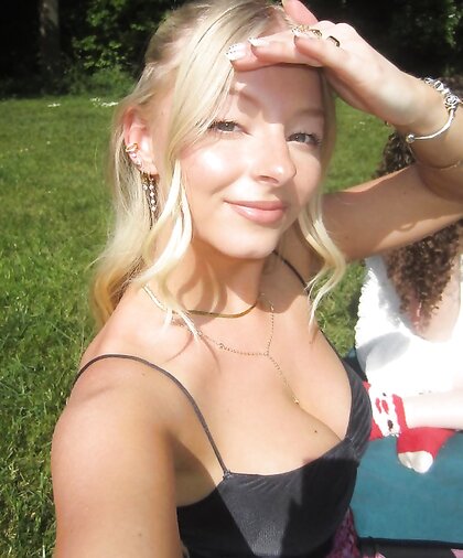 Petite teen shows off her big tits